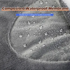 Detailed close-up of grey waterproof flannel pet blanket showing composite waterproof membrane.