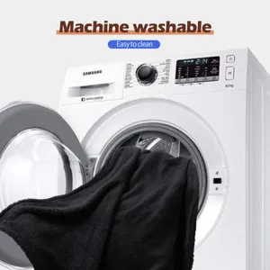 Detailed view of soft black flannel pet blanket, highlighting machine washable feature.