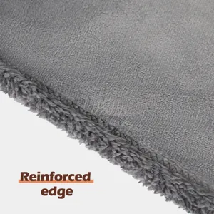 Close-up detail showing the soft grey flannel pet blanket with a durable reinforced edge.
