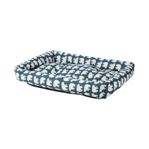 Close up view of the blue animal printed pet bed featuring thick raised edges for small dogs.