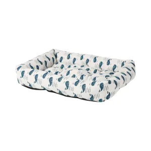 Detailed view of the soft pet bed with cute blue whale pattern, comfortable and cozy.