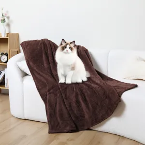 Thickened flannel pet blanket detail shot, showing soft brown plush texture and cozy sofa setting for cats and dogs.