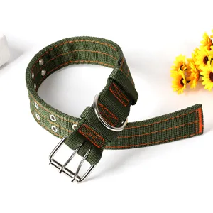 Close-up detail of tactical dog collar, thickened green nylon with orange stitching and metal rings.
