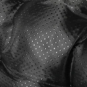 Non-slip bottom fabric detail of pet bed, durable black dotted material for stability.