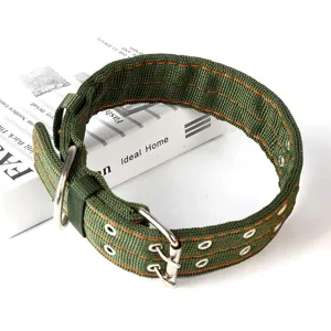 Tactical dog collar detail, thickened green nylon, orange stitching, adjustable metal eyelets.