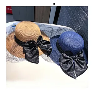 Hepburn style straw hat with black bow and veil, elegant sun protection beach hat for women.