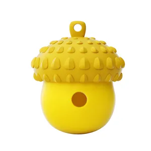 Jouet distributeur de friandises pour chien en silicone pomme de pin principale.