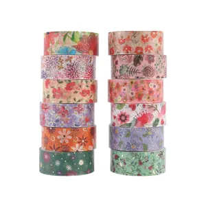 Close-up detail of colorful floral washi tape stacks with gold foil accents for crafting.