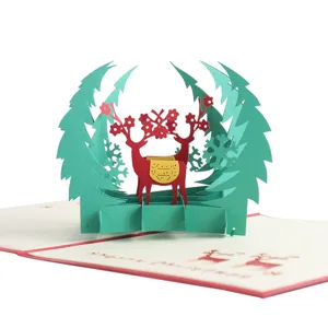 Detailed view of 3D pop up Christmas greeting card laser cut paper deer tree holiday gift card