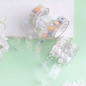 Transparent PET washi tape with cute daisy flower designs, perfect for journaling and DIY crafts.