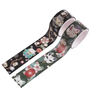 Detailed close-up of Japanese style gold foil washi tape rolls featuring cute cats and masks.