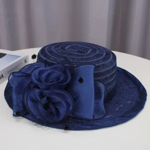 Elegant navy blue women's flat top hat with lace and fabric flowers for summer style.