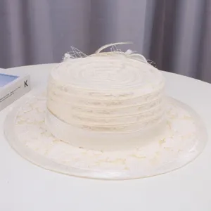 Detailed view of women vintage off-white lace flat top boater hat with mesh and feather decor.