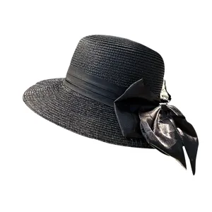 Elegant black straw sun hat for women with bow ribbon, perfect for summer vacation and outdoor travel.