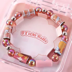 Kids DIY sticker bracelet toy set with cute tearable sticker rolls and colorful shiny beads.
