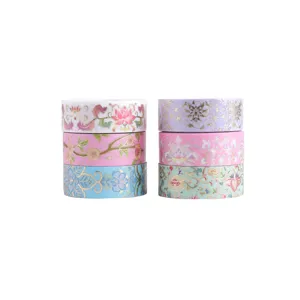 Decorative gold-stamped washi tape set featuring elegant floral patterns for journaling.