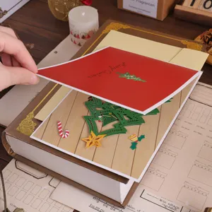 3D pop-up Christmas tree greeting card detail view, hollow paper carving design for holiday gift.