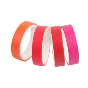 Detailed view of colorful Japanese washi adhesive tapes in gradient rainbow shades for DIY crafts.