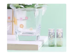 Transparent PET decorative tape with daisy flower pattern for journaling and DIY crafts.