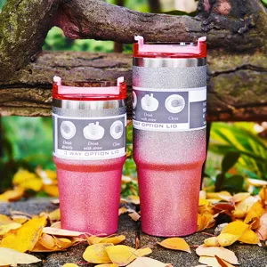 Detail of glitter 30oz travel tumbler with 3-way lid in outdoor autumn setting