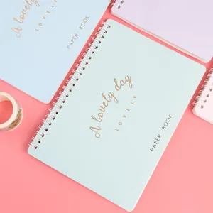 A5 pastel spiral notebook planner with golden foil typography for daily journaling and DIY crafts.