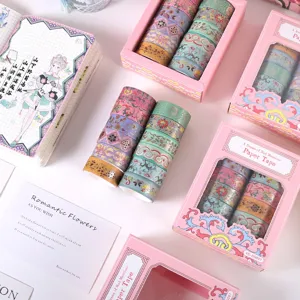 Boxed gold foil washi tape set with vintage floral patterns for DIY journaling.