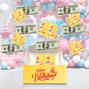 Birthday surprise money pulling box with pop-up cards and fake dollar bills for party.