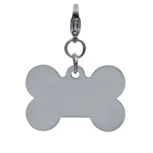 Stainless steel bone shaped pet ID tag pendant detail close up, blank metal name tag.