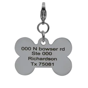 Stainless steel bone-shaped pet ID tag with secure clasp and custom engraving address text.
