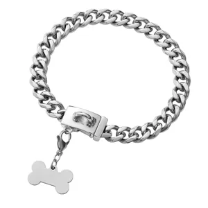 Close-up detail of the 13mm stainless steel cuban link pet dog collar with bone tag.