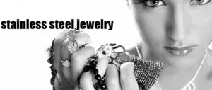 Detail view of stylish stainless steel fashion jewelry rings and bracelets set for modern women.