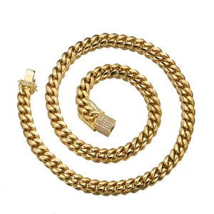 Detailed close-up of gold stainless steel Miami Cuban link chain with micro pave diamond clasp.