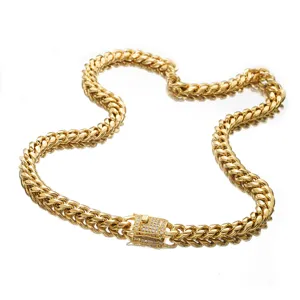 Detailed view of gold Cuban chain necklace featuring a stunning micro-paved diamond clasp.