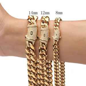 Gros plan détaillé de chaînes cubaines dorées de 14mm, 12mm et 8mm avec cadenas pavé de diamants.