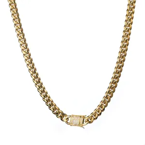 Gold Cuban link chain detail, featuring micro-pave zirconia clasp and durable stainless steel.