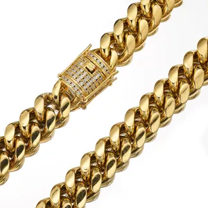 Detailed close-up of gold stainless steel Miami Cuban link chain with micro pave crystal box clasp.