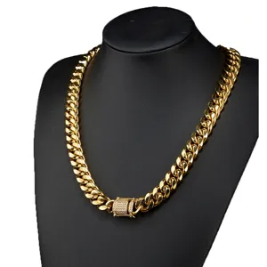 Detailed view of the gold stainless steel Cuban link necklace with micro-pave diamond lock clasp.