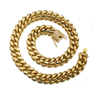 Detail view of the gold Miami Cuban link chain necklace featuring a sparkling iced out clasp.