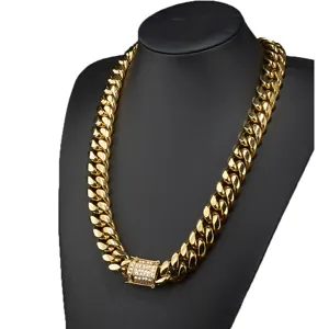 Close-up detail of the gold Cuban link chain featuring a sparkling micro-paved stone clasp.