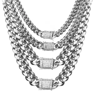 Detailed shot of layered iced out Cuban link chains, shining silver stainless steel design.