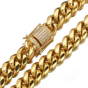Close-up detail of gold Cuban chain necklace with micro-paved diamond box clasp.