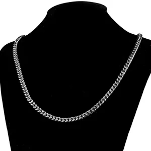 Detailed view of the stainless steel Cuban chain necklace, showing smooth metallic links.