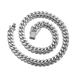 Detailed view of Miami Cuban link chain necklace featuring a paved crystal clasp in silver tone.