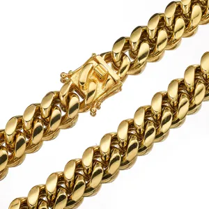 Close-up detail of a mens gold titanium steel cuban link chain necklace with secure box clasp.