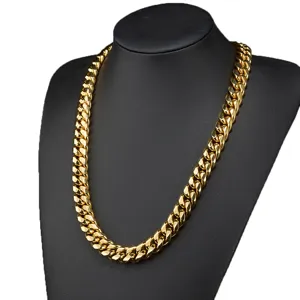 Detailed close-up shot of the thick gold Cuban link chain necklace, displaying metal finish.