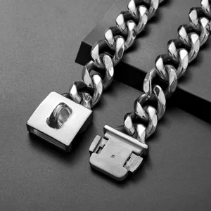 Detailed view of thick stainless steel cuban link dog chain collar with secure buckle.