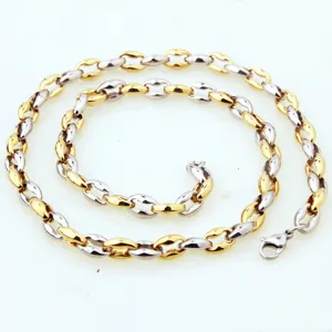 Close-up detail of the two-tone stainless steel coffee bean chain necklace, sleek and durable links.