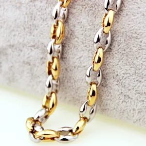 Close-up detail of men's two-tone stainless steel coffee bean chain necklace, polished finish.