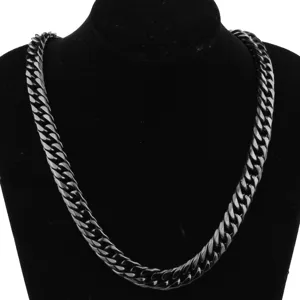 Closeup detail of black titanium steel cuban link chain necklace for men fashion jewelry.