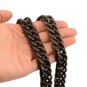 Detail view of chunky black stainless steel Cuban link chain necklace for men fashion jewelry.